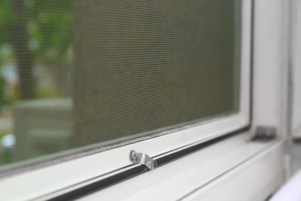 Roll-down screen system for a protected Florida lanai opening