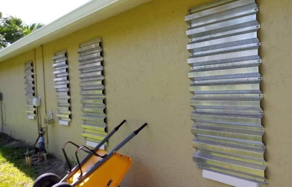 Storm panels staged for a sliding glass door opening